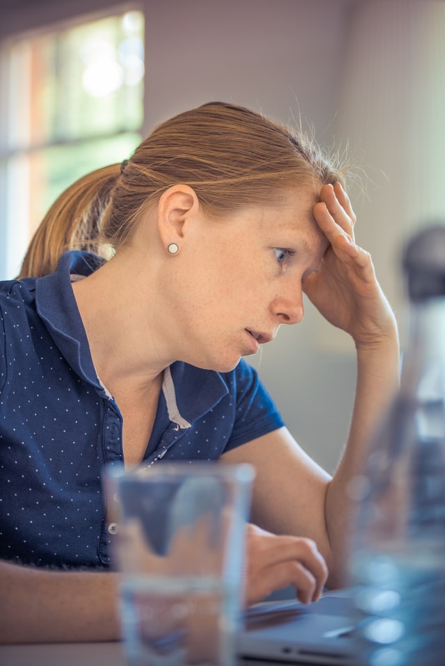 anxious woman sitting indoors